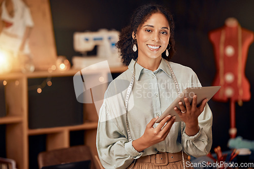 Image of Fashion designer, woman and tablet in in retail studio, manufacturing workshop or small business. Portrait, smile and happy seamstress with digital technology for clothing ideas, innovation or vision