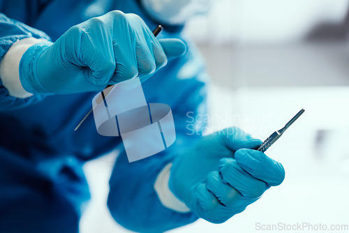Image of Healthcare, surgeon and hands with a scalpel for procedure in an operating room at hospital. Closeup of doctor or nurse with medical equipment for surgery in emergency room at medicare clinic center.