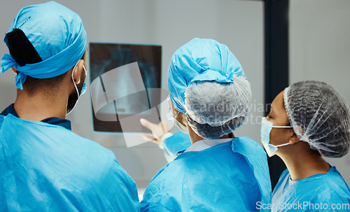 Image of Medical, x ray and surgery with doctors planning in meeting for mri scan, strategy or research. Medicine, consulting and radiology image with healthcare surgeons for diagnosis, treatment or operation