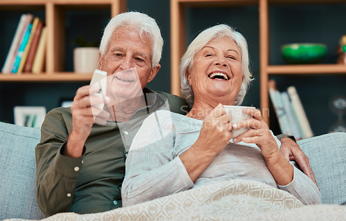 Image of Elderly couple, laugh and relax watching tv with coffee on the living room sofa together at home. Happy senior man and woman relaxing, streaming and laughing for entertainment, movie or show on couch