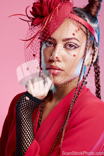 Image of Portrait of edgy woman, creative fashion with vintage aesthetic or unique retro style in San Francisco studio. Young girl with designer clothing, unique funky accessories or model on pink background