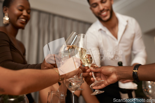 Image of Diverse group, champagne toast and New Years eve party in a house for fun and celebration. Wine, glasses and multiracial people celebrating and cheers with drink at a social gathering while partying