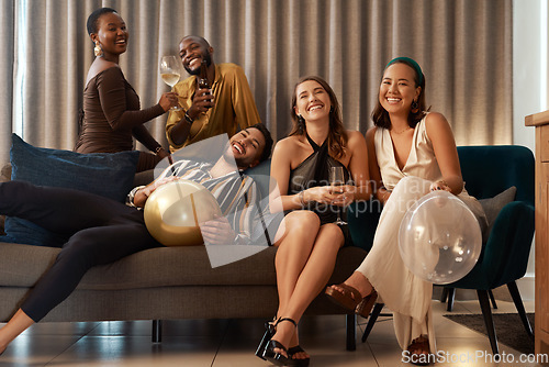 Image of Party, new year and alcohol with friends on a sofa together in celebration of a milestone event. Birthday, happy and bonding with a man and woman friend group in a living room to relax or celebrate