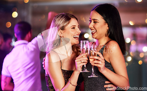 Image of Party, champagne and lesbian couple toast at nightclub, having fun and bonding. Celebration, cheers and happy women with wine or alcohol at new year event, laughing or enjoying quality time together.