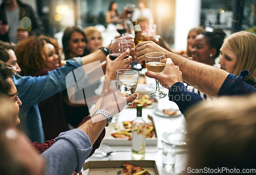 Image of Dinner, toast and friends at restaurant for party celebration, social gathering and new years eve holiday. Alcohol, Christmas party and group of men and women cheers at dinner party with cocktails