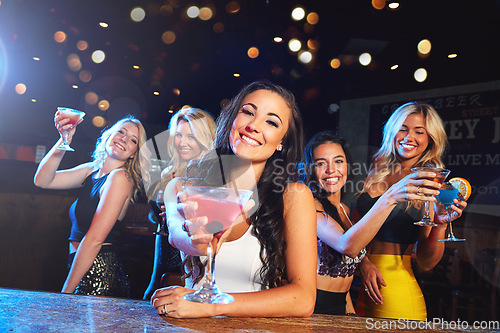 Image of Party, nightclub and portrait of women with cocktail for cheers, toast and celebration on ladies night. Alcohol, social event and happy female friends enjoy happy hour at rave, disco and cocktail bar