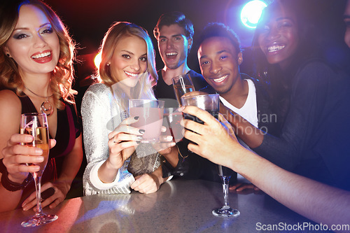 Image of Friends with cocktail drinks, toast in nightclub and smile in party portrait, new year celebration with happy people. Drinks, club and happy hour, champagne and cocktails to celebrate with cheers.