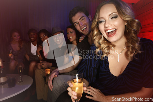 Image of Champagne, party and group of friends at nightclub to celebrate new years event. Luxury celebration, diversity in friendship and happy hour at club for New Year gathering, portrait of woman at disco.