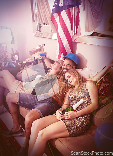 Image of Drunk, happy birthday or friends sleeping in a party on house sofa with a hangover from beer or alcohol. Happy man, tired women or crazy people nap on couch at fun new year celebration in Texas, USA