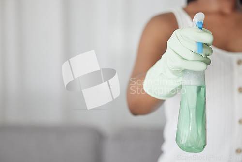 Image of Woman, hand glove and product for cleaning, hygiene or cleaning service with detergent in home. Eco friendly chemical, spray bottle with disinfectant or cleaning supplies with cleaner in house