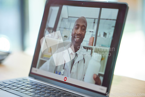 Image of Healthcare, video call and consulting on laptop with doctor for patient advice, update and results. Communication, technology and internet app with male black doctor holding medicine recommendation.