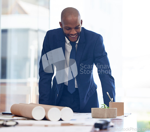 Image of Businessman, happy and architect blueprint in office for building construction, engineering or architecture project illustration. African man, smile and working on industrial design or business plan