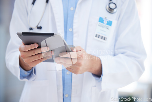 Image of Healthcare, technology and hands of doctor with tablet online to review patient report, results and diagnosis. Medical worker with digital tech for insurance in hospital, clinic or health facility