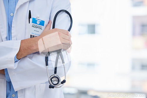 Image of Healthcare, stethoscope and doctor in a hospital with mockup space in consultation room. Medical, service and closeup of professional surgeon after surgery in medicare clinic or center with copyspace