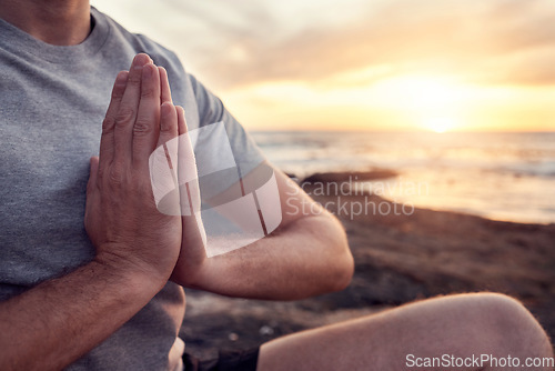 Image of Beach, meditation and hands praying of fitness, yoga or training man in morning sunrise on the horizon for healing, peace and zen. Calm, spiritual and pilates man prayer sign in nature, sea or ocean