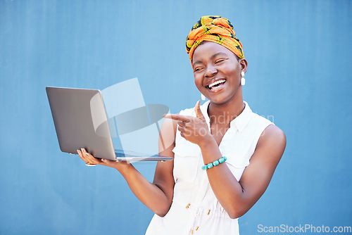 Image of Laptop success, email and happy black woman with communication, online work and pointing at internet on blue background in studio. Computer, digital business and worker impressed with web networking