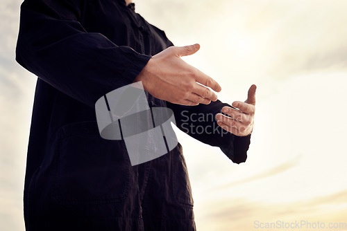 Image of Praying, worship and Muslim man in nature for gratitude, peace and trust in God against a sky. Hope, Islam and person with hands for a prayer, Islamic praise and faith during Ramadan and sunset