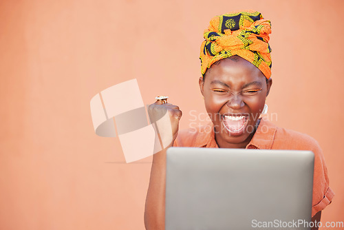 Image of Success, celebration and black woman on laptop after winning on an orange studio background mock up. Face, winner and female on computer after online lottery win or reading good news on social media.