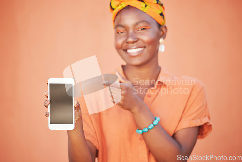 Image of Mockup, black woman and blank smartphone screen for marketing, advertising and against brown studio background. Female, Jamaican lady and phone for social media, search internet and online website.