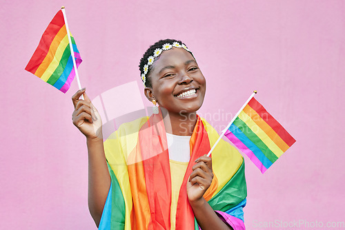 Image of Black woman, flag and pride with lgbtq portrait, freedom and support queer community with happiness against pink background. Rainbow, sexuality and free to love mockup, celebrate lgbt and equality.