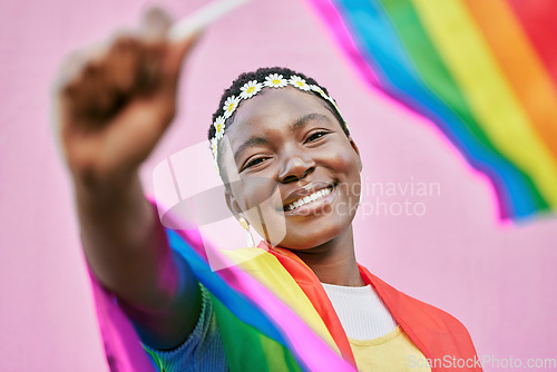 Image of LGBT, pride and portrait of black woman with rainbow flag for self love, individuality and support for the LGBTQ community. Equality, human rights and face of bisexual, gay or lesbian African girl