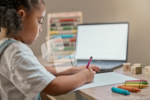 Image of Home school, blank computer and girl writing in a study notebook learning for child development. Online eduction, technology and kid working with a pencil on a pc student app for education in a house