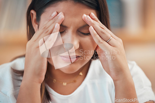 Image of Headache, stress and anxiety with a business woman holding her head in pain while feeling pressure. Burnout, mental health and migraine with a female employee struggling to make a project deadline