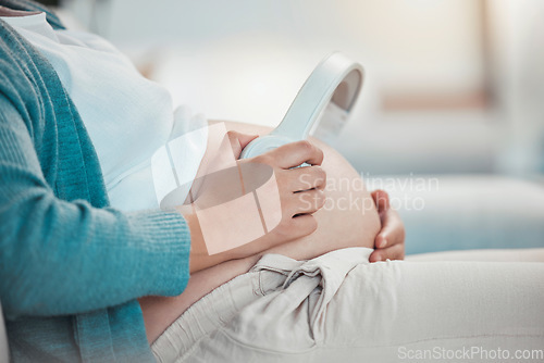 Image of Relax, pregnant woman and headphones on stomach, music playing for baby in living room. Pregnancy, earphones on belly and technology, woman on sofa streaming audio sound for child listening in utero.