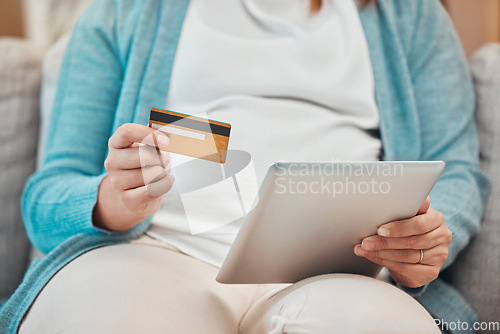 Image of Tablet, hand and credit card for online shopping, ecommerce and banking using a mobile app. Technology, card and fintech for payment, budget or bills on the internet with debit card for e commerce