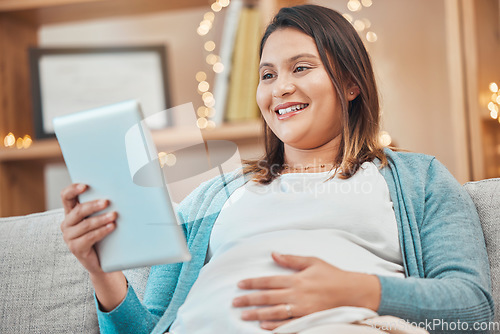 Image of Relax, pregnancy and woman on sofa with tablet in living room at home reading email or ebook. Internet, video call or social media, happy pregnant woman sitting on couch with smile surfing online.