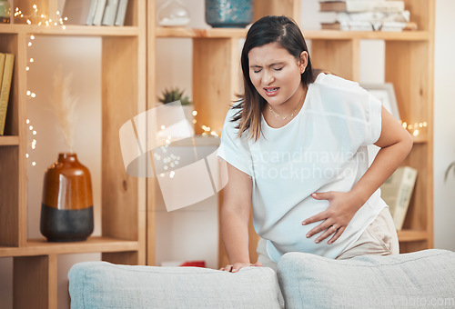 Image of Pregnant woman, pain and cramps with hand on stomach for abdominal problem, discomfort or childbirth contractions for labour. Female with stress, stomachache or spasm causing miscarriage in pregnancy