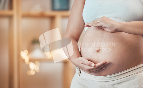 Image of Pregnant, stomach and woman frame her belly in maternity ready for motherhood to be a parent. Motherhood, abdomen and pregnancy with a female ready to have a family and babies at home