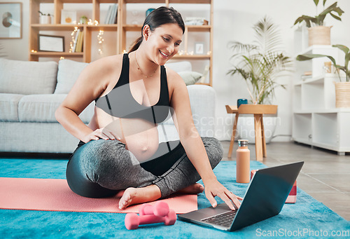 Image of Pregnant woman, laptop and home workout with yoga tutorial while streaming online for exercise, fitness and pilates for health and wellness. Female on internet for virtual pregnancy class or webinar