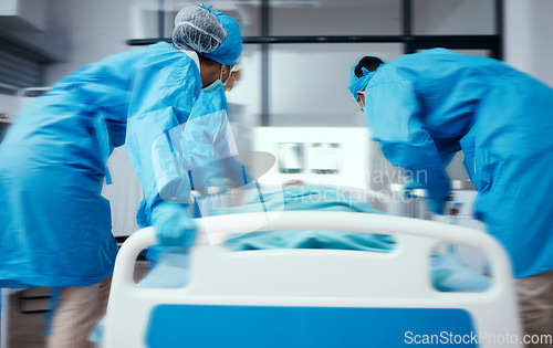 Image of Emergency, operation and hospital with a doctor and team rushing to an operating theater with a patient. Nurse, insurance and healthcare with a medical group getting ready for life saving surgery