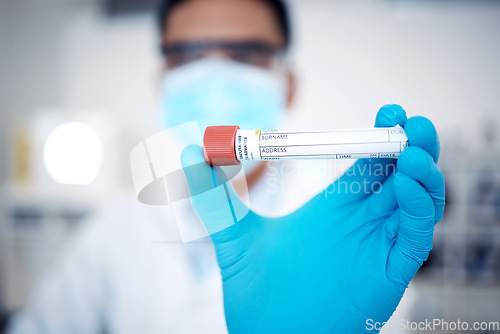 Image of Closeup, test tube and lab for dna results, experiment and in laboratory with gloves for protection. Male scientist, man and medical for safety for virus, sickness or blood sample for cure or illness