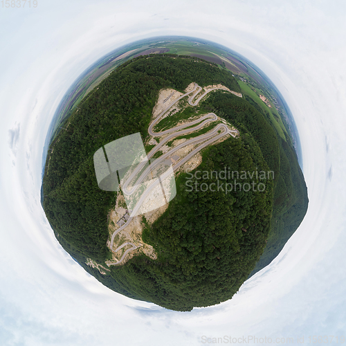 Image of 360 spherical panorama of aerial top vew of winding road in the mountains