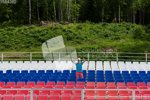 Image of Lonely boy on the empty stadium outdoor