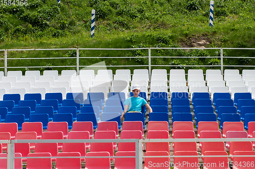 Image of Lonely boy on the empty stadium outdoor