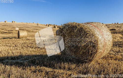 Image of stack of straw , summer time