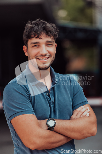 Image of Portrait of a young successful entrepreneur in front of the company