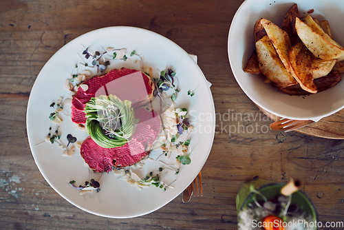 Image of Food, health and breakfast with avocado toast from top view for diet, nutrition and vegan in coffee shop. Bread, sandwich and brunch with beetroot hummus for luxury, cafe an restaurant fine dining