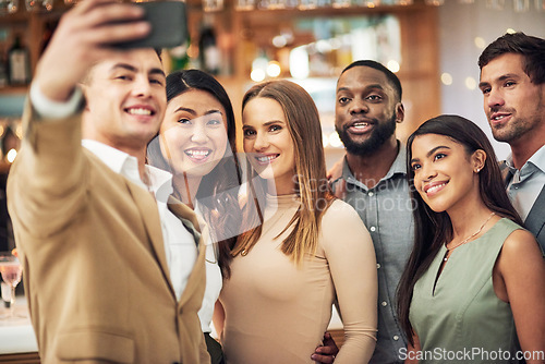 Image of Group of friends, selfie and party for celebration, smile and bonding in restaurant. Diversity, young business people and corporate event for fun, relax and device to connect, social media and team.