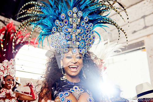 Image of Black woman, samba dancer and smile for festival, concert or party performance at New Year event. Portrait of happy African American female in beautiful art costume performing in music culture show