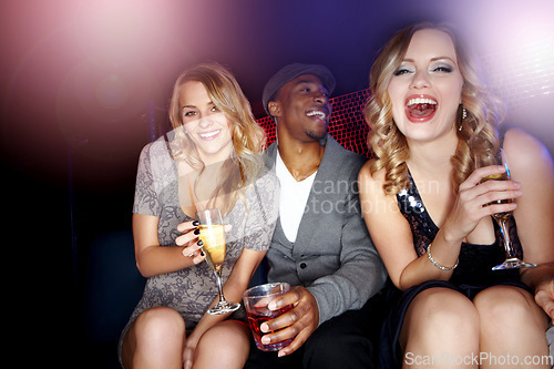 Image of Party, drinks and friends at nightclub while happy to celebrate a birthday, new years or happy hour with a smile and happiness portrait. Women and a man at a club to celebrate with alcohol champagne