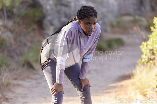 Image of Fitness, mountain and black woman tired from running, marathon training and exercise in nature. Wellness, endurance and female athlete taking a break, rest and breathe to relax after sports workout