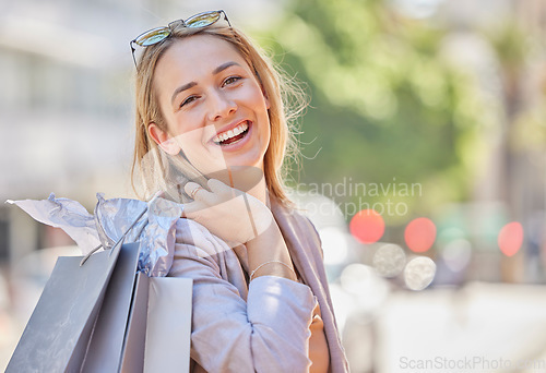 Image of Woman, happy portrait and shopping bag walking in city for retail therapy, fashion promotion or customer happiness. Clothes market success, smile and shopper freedom in New York street mall boutique