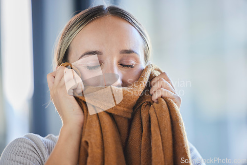 Image of Clean laundry, woman and smelling fabric, fresh scent of clothes and textile linen at home. Scent, fragrance and aroma from spring cleaning, housekeeping and household maintenance in laundry room