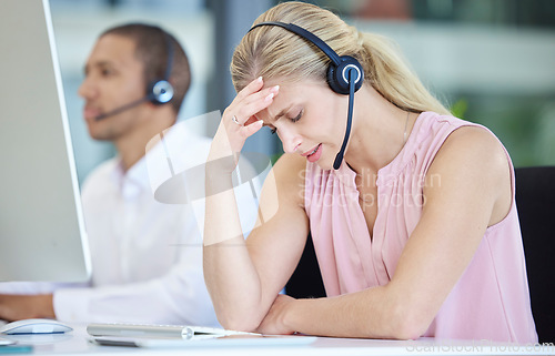 Image of Stress, headache and call center consultant in the office doing online customer service consultation. Burnout, tired and frustrated ecommerce sales woman or telemarketing agent working in workplace.