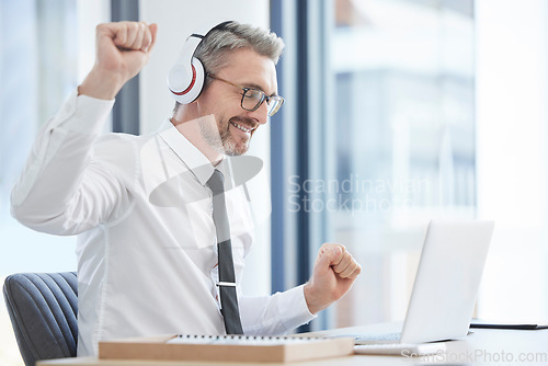 Image of Relax, music and dance with businessman and laptop for streaming, freedom and winner. Energy, celebration and online with employee listening at desk in corporate office for radio, disco or rock break