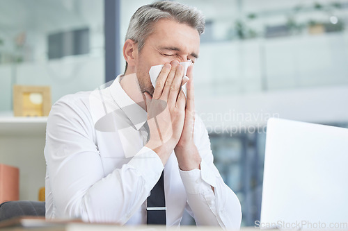Image of Allergies, sick and businessman in his office cleaning nose with healthcare risk, workplace compliance policy and management stress. Dust, bacteria and allergy of business or corporate man at a desk
